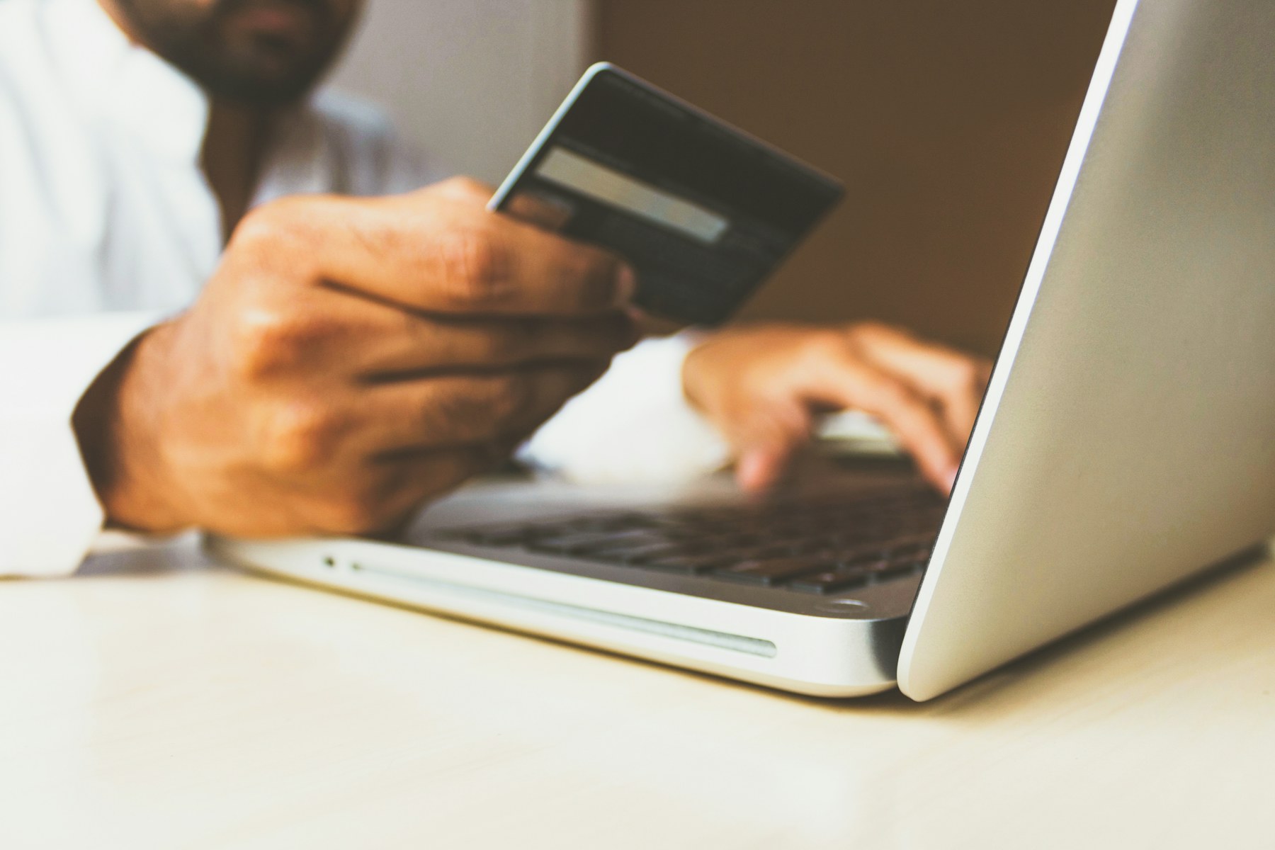 Secure digital payment work on a laptop with a payment card